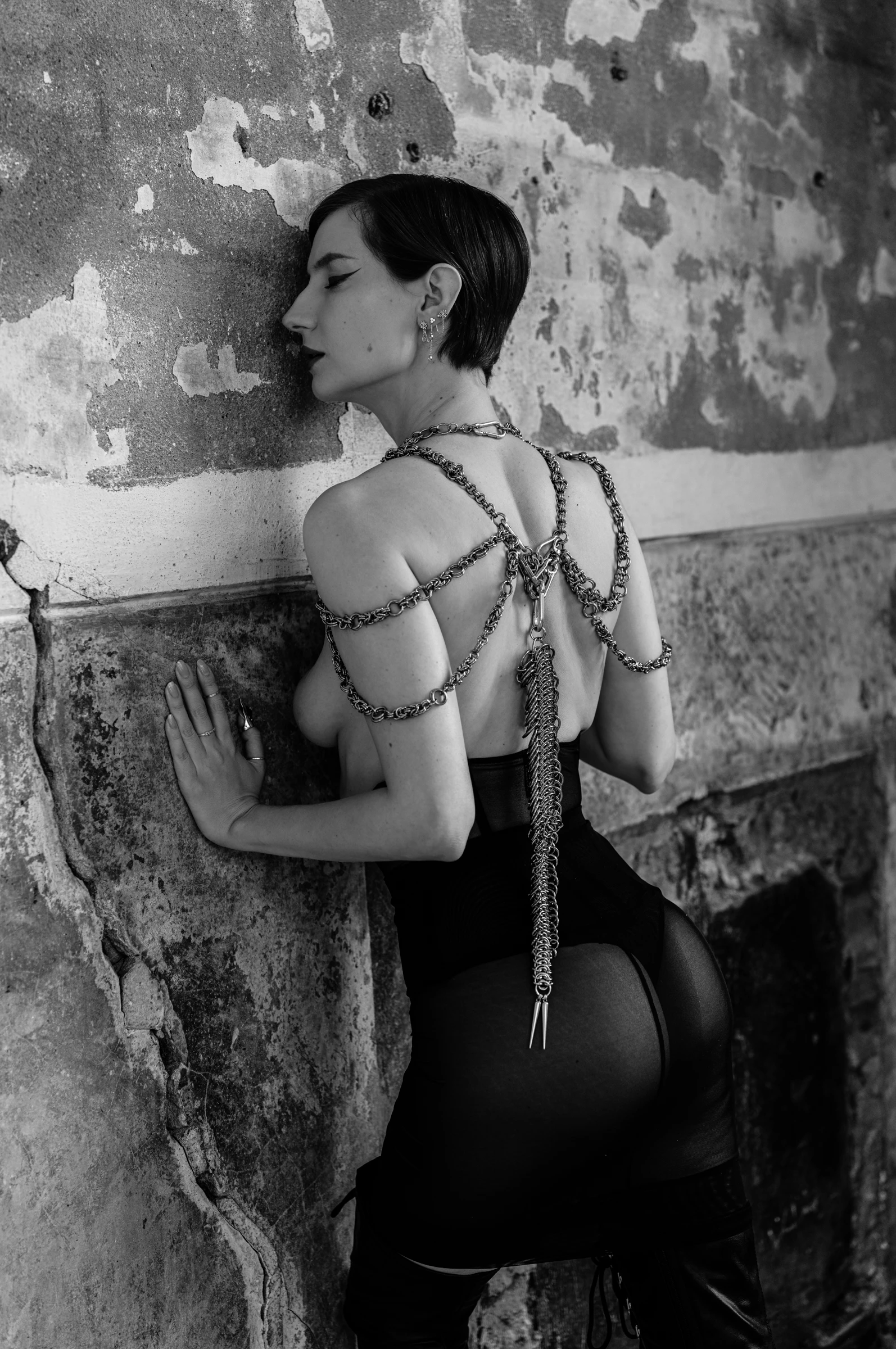 woman leaning against the wall